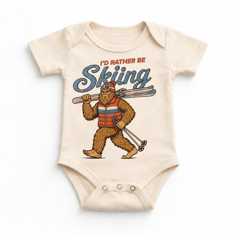 I'd Rather Be Skiing retro Bigfoot carrying skis design on a natural baby bodysuit