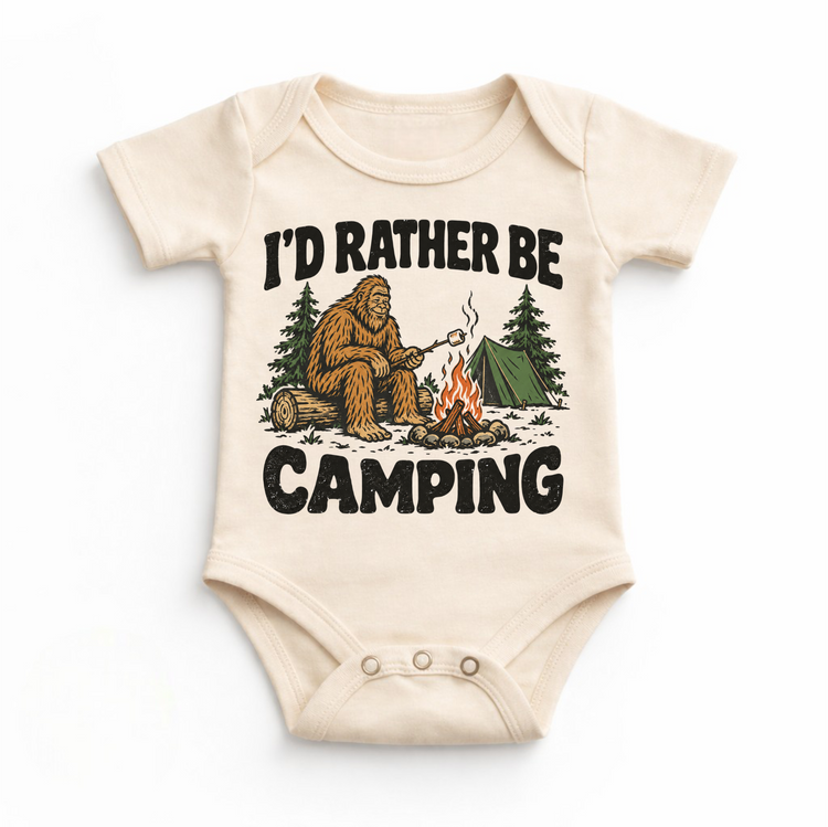 I'd Rather Be Camping Bigfoot roasting a marshmallow by a campfire on a natural baby bodysuit