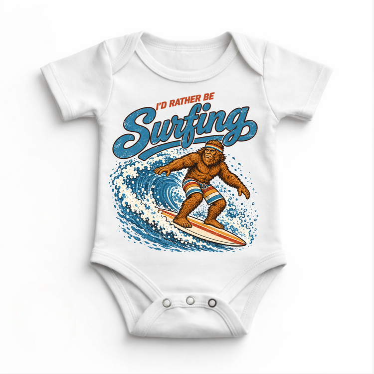 I'd Rather Be Surfing Bigfoot riding a wave design on a white baby bodysuit
