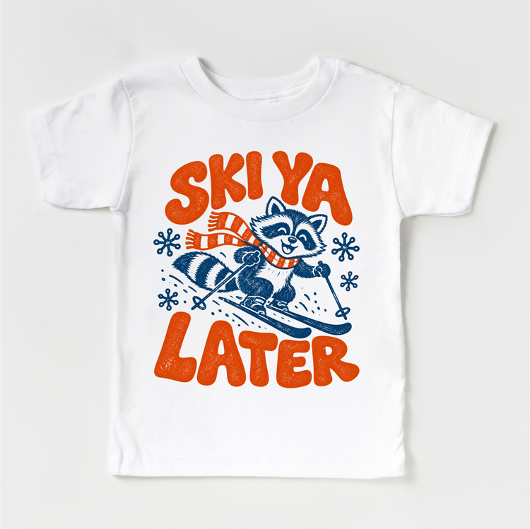 Ski Ya Later skiing raccoon in navy and orange on a white short sleeve tee