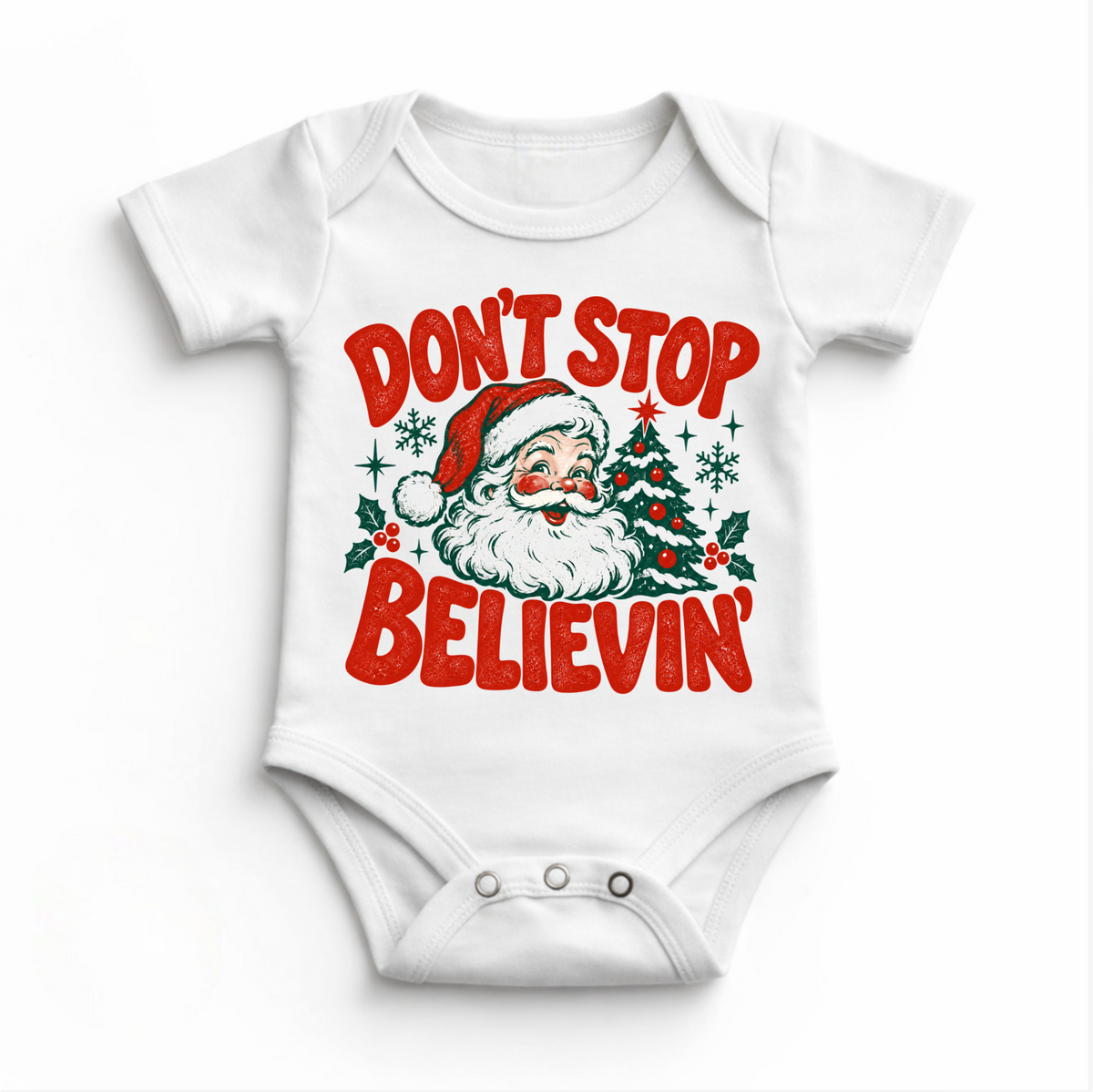 Don't Stop Believin' retro Santa and Christmas tree graphic in red and green on a white baby bodysuit