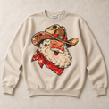 Sand Gildan crewneck sweatshirt with vintage cowboy Santa in western hat and red bandana