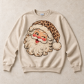 Sand Gildan crewneck sweatshirt with vintage winking leopard Santa graphic
