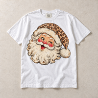 White Comfort Colors short-sleeve T-shirt with vintage winking leopard Santa graphic