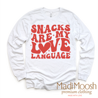Snacks Are My Love Language Valentine's Day design on a long sleeve shirt.