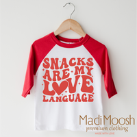 Snacks Are My Love Language Valentine's Day design on a red-accented shirt.