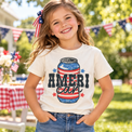 Child wearing a Natural Ameri Can Shirt at a patriotic summer gathering
