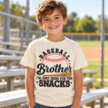 Generated lifestyle mockup of the Baseball Brother I'm Just Here for the Snacks shirt in Natural at the ballpark.