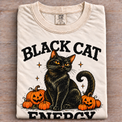 Natural folded Comfort Colors Black Cat Energy Halloween tee with oversized print