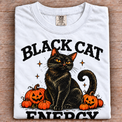 White folded Comfort Colors Black Cat Energy Halloween tee with oversized print