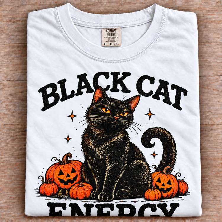 White folded Comfort Colors Black Cat Energy Halloween tee with oversized print