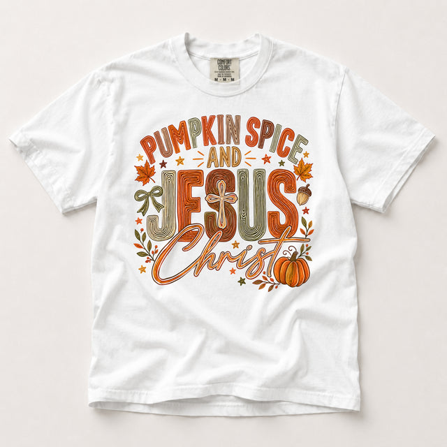 White Comfort Colors T-shirt with Pumpkin Spice and Jesus Christ fall graphic in orange, brown and olive with a cross and pumpkin.