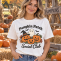 Pumpkin Patch Social Club Comfort Colors Halloween shirt in White worn by a female model