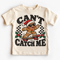 Can't Catch Me Christmas graphic on natural tee, front view on white background