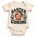 Santa's Coming Christmas graphic on natural bodysuit, front view on white background
