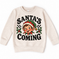 Santa's Coming Christmas graphic on natural sweatshirt, front view on white background