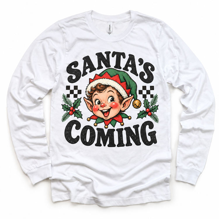 Santa's Coming Christmas graphic on white long sleeve tee, front view on white background