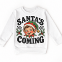Santa's Coming Christmas graphic on white sweatshirt, front view on white background