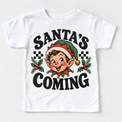 Santa's Coming Christmas graphic on white tee, front view on white background