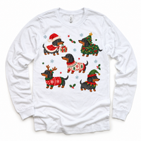 white long sleeve tee with five dachshunds in Christmas costumes, holly and snowflakes