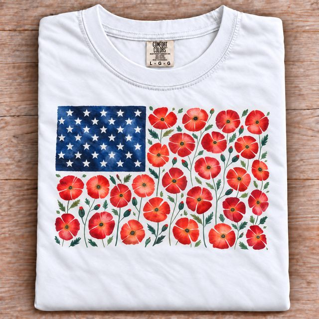 Folded white Comfort Colors T-shirt with a red poppy floral American flag graphic