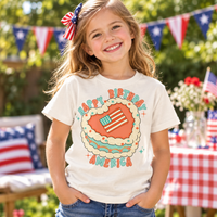 Child wearing a Natural Happy Birthday America Shirt at a patriotic summer gathering