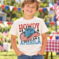 Child wearing a Natural Howdy America Shirt at a patriotic summer gathering