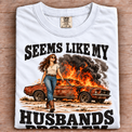white folded Comfort Colors Seems Like My Husbands Problem tee