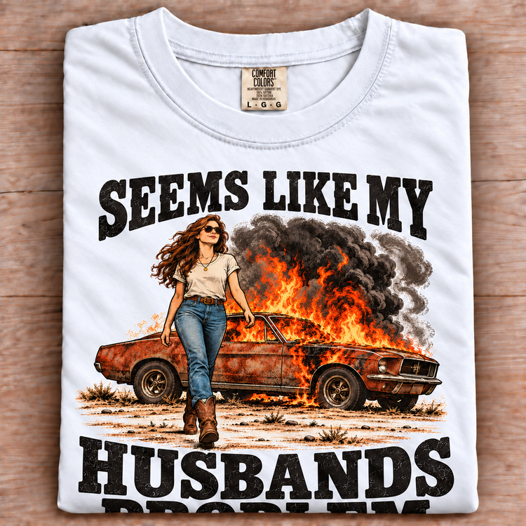 white folded Comfort Colors Seems Like My Husbands Problem tee