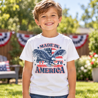 Boy wearing white Made In America Shirt outdoors