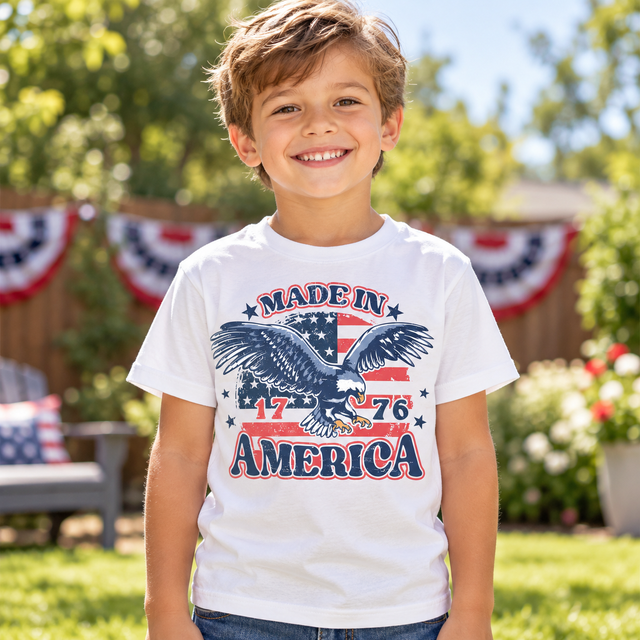 Boy wearing white Made In America Shirt outdoors