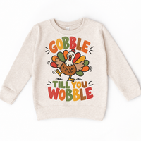 Gobble Till You Wobble Turkey design on a natural sweatshirt