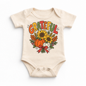 Grateful Sunflower Pumpkin design on a natural bodysuit