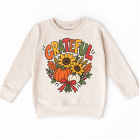 Grateful Sunflower Pumpkin design on a natural sweatshirt
