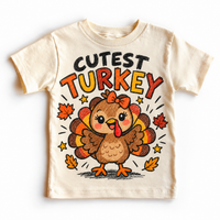 Cutest Turkey graphic on natural tee, front view on white background