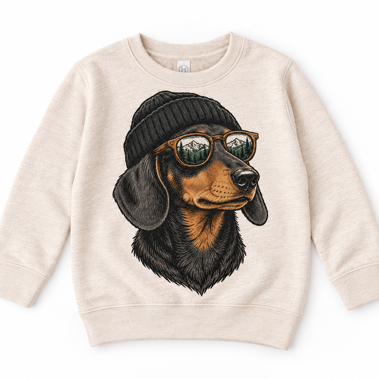 Dachshund wearing a beanie and mountain sunglasses printed on natural sweatshirt, front view