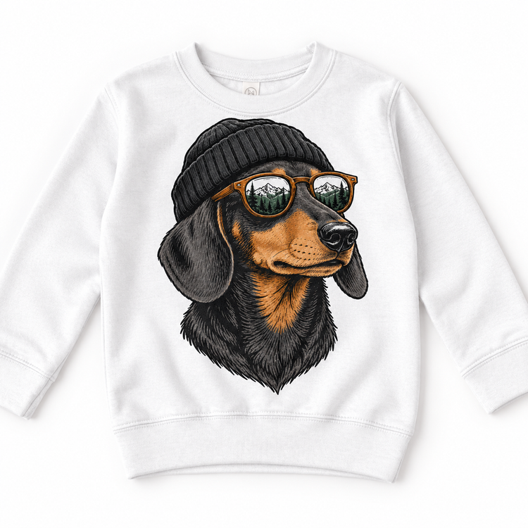 Dachshund wearing a beanie and mountain sunglasses printed on white sweatshirt, front view