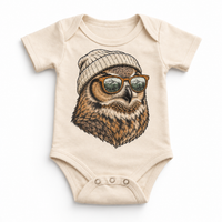 Owl wearing a beanie and mountain sunglasses printed on natural bodysuit, front view