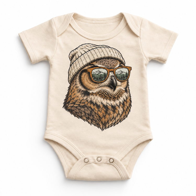 Owl wearing a beanie and mountain sunglasses printed on natural bodysuit, front view