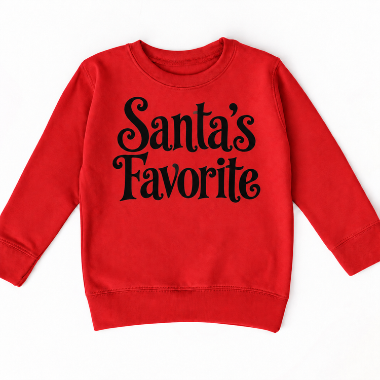 Santa's Favorite Christmas shirt features elegant black lettering with curled details. Shown on red sweatshirt, front view.