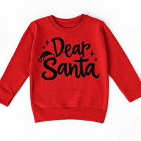 Dear Santa Christmas shirt features black script lettering, a Santa hat and stars. Shown on red sweatshirt, front view.