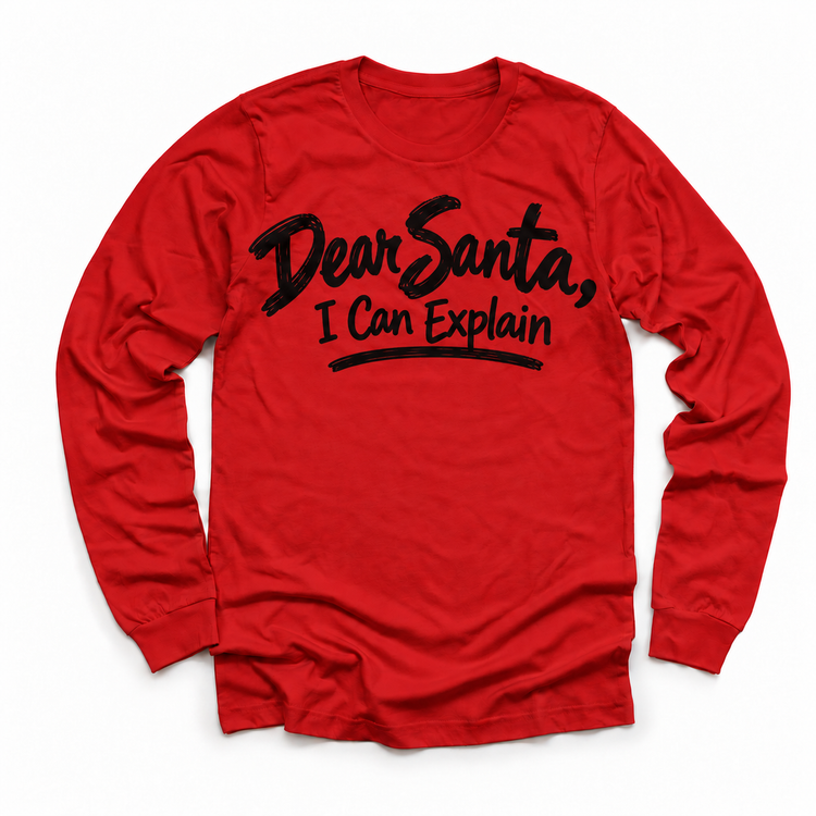 Dear Santa I Can Explain shirt features black brush lettering and a sweeping underline. Shown on red longsleeve, front view.