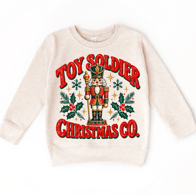 natural sweatshirt with vintage nutcracker, holly and Toy Soldier Christmas Co. lettering