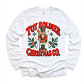 white long sleeve tee with vintage nutcracker, holly and Toy Soldier Christmas Co. lettering