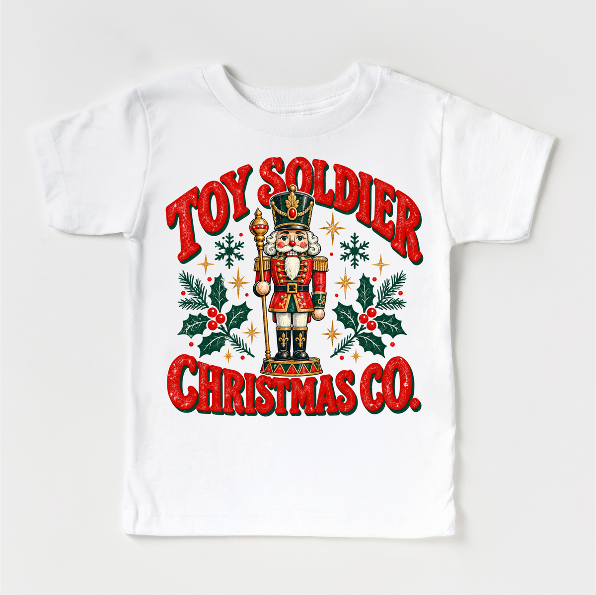 white tee with vintage nutcracker, holly and Toy Soldier Christmas Co. lettering
