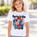 Girl wearing a white Party In The USA graphic tee in bright natural light.