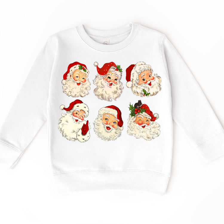 Six vintage Santa faces with red hats and holly on a white sweatshirt