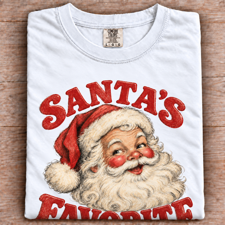 Santa's Favorite vintage Christmas graphic on folded white tee