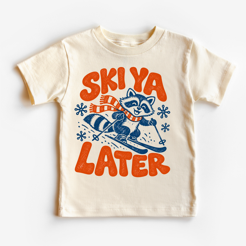 Ski Ya Later skiing raccoon graphic on a natural kids T-shirt