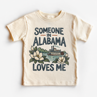Someone in Alabama Loves Me design on a natural beige short sleeve T-shirt